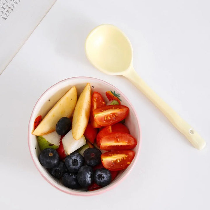 Stylish pastel ceramic spoons in green, yellow, white, and pink ready to enhance your tableware collection