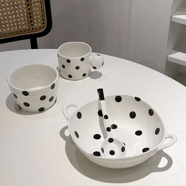 Stack of polka dot ceramic dishes in assorted colors and patterns