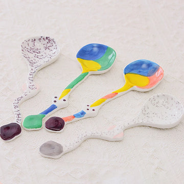 Set of colorful ceramic spoons with unique, artistic designs