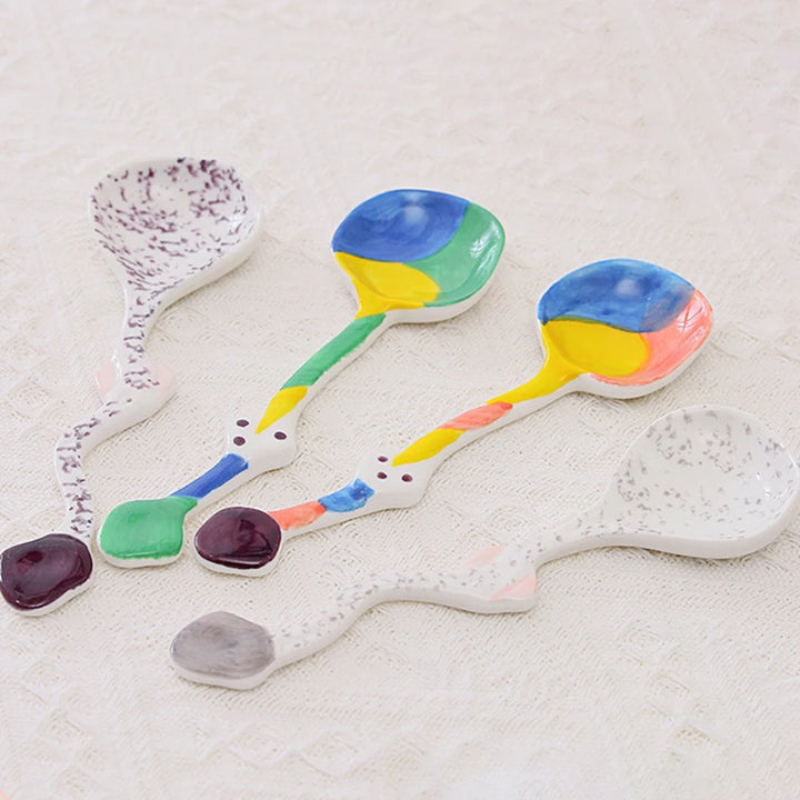 Set of colorful ceramic spoons with unique, artistic designs
