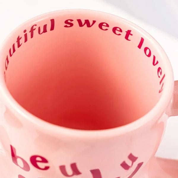 Pink and blue aesthetic wavy ceramic mugs with quirky "beautiful, sweet, lovely" text.