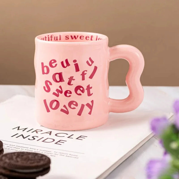 Pink  aesthetic wavy ceramic mugs with quirky "beautiful, sweet, lovely" text.