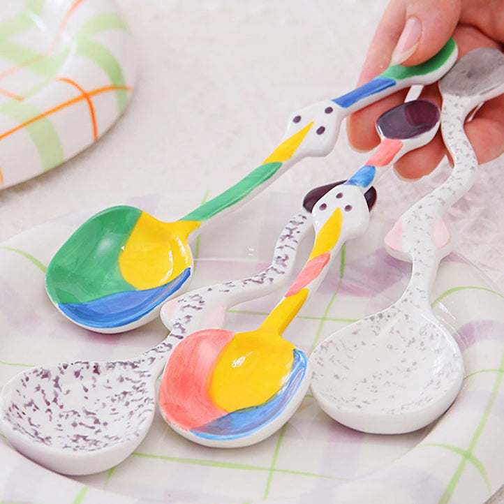Set of colorful ceramic spoons with unique, artistic designs