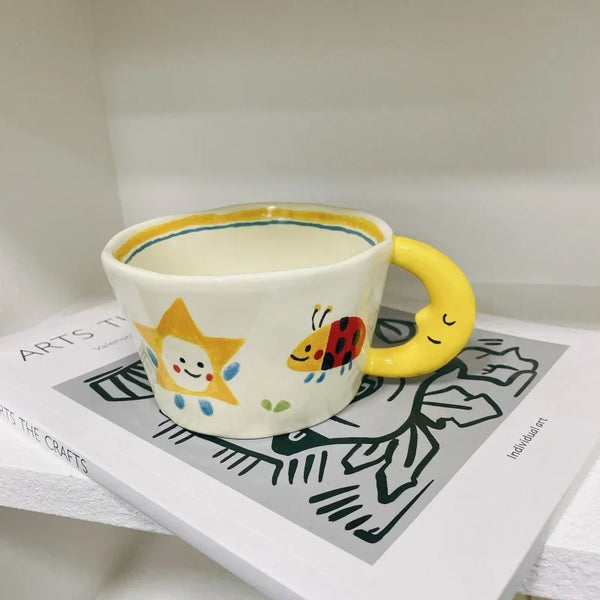 Cute Ceramic Mug with Cartoon Star, Ladybug, and Moon Handle Design