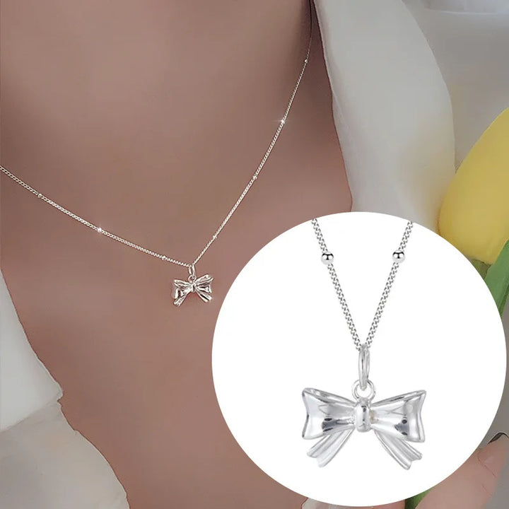 Silver bow necklace