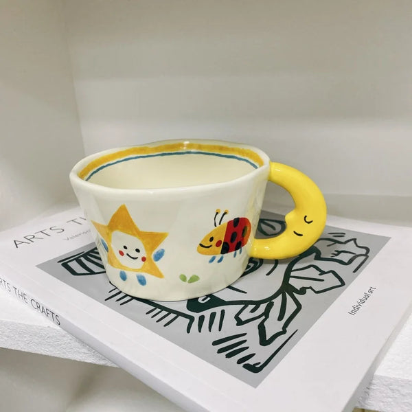 Cute Ceramic Mug with Cartoon Star, Ladybug, and Moon Handle Design