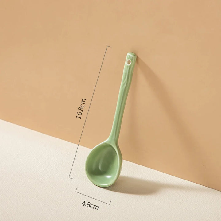 Close-up of pastel ceramic spoon showcasing their soft colors and high-quality finish