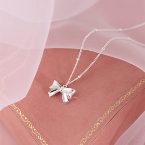 Silver bow necklace