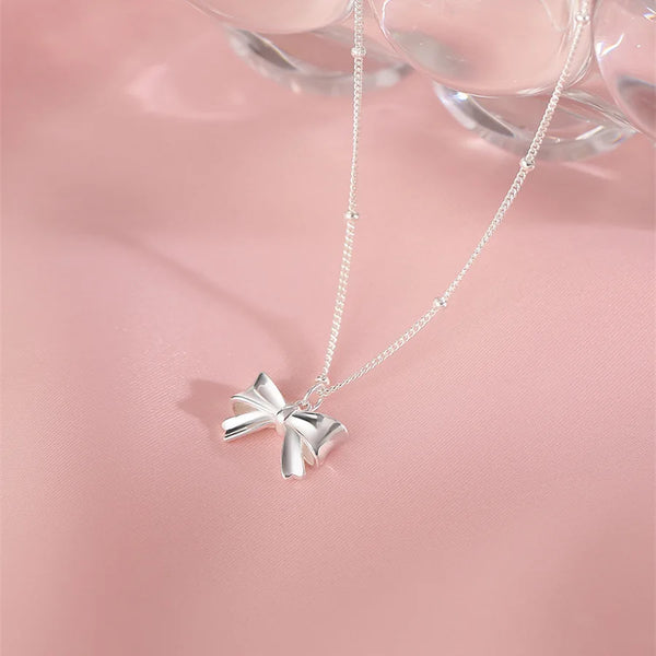 Silver bow necklace