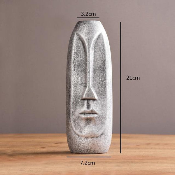 abstract face vase tall silver
