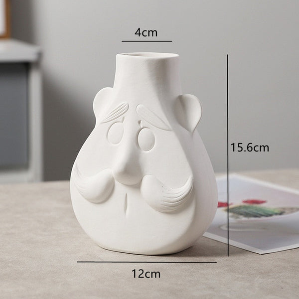 white ceramic flower vase