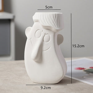 white ceramic flower vase
