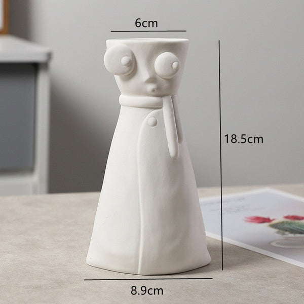 white ceramic flower vase