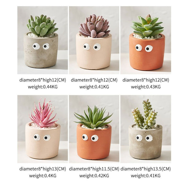 cement flower pot with artificial succulents