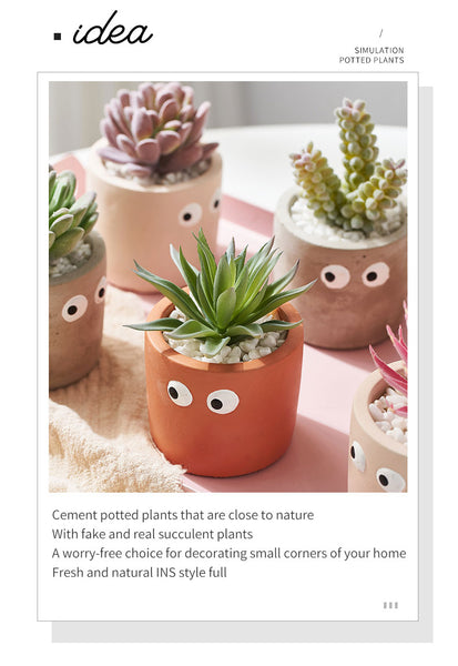 cement flower pot with artificial succulents