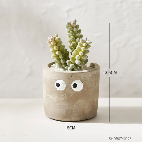 cement flower pot with artificial succulents e